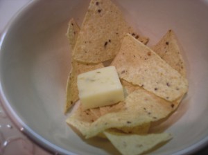 Add chips and cheese .  Then ladle in the soup!