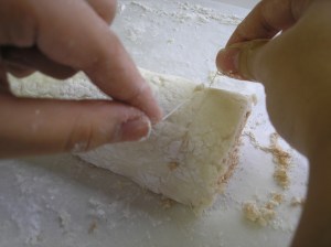 Place floss under the dough and pull to middle